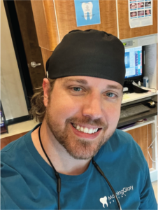 Ryan rutar dental hygienist in green scrubs on operatory