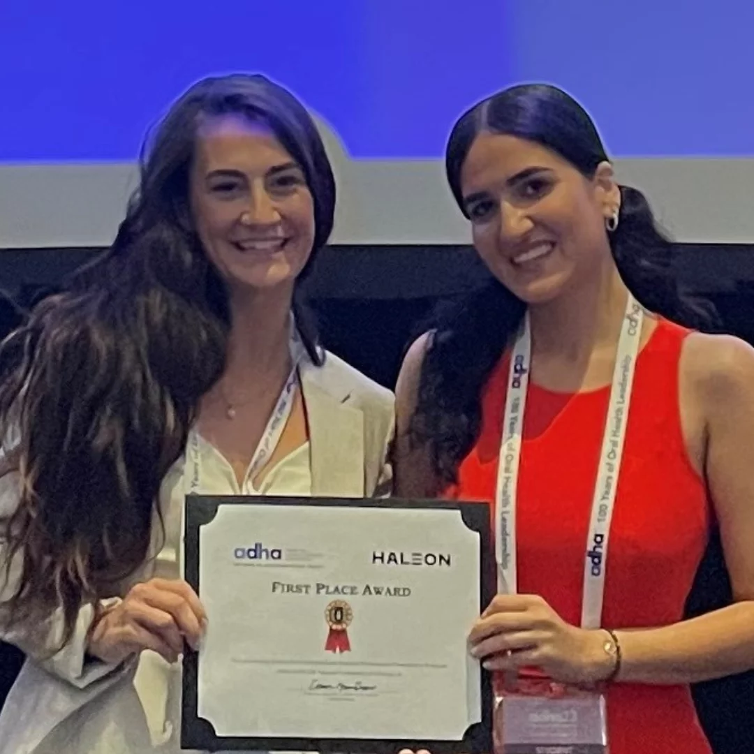 Emily Berry and Mina Ghorbani hold their 1st place award