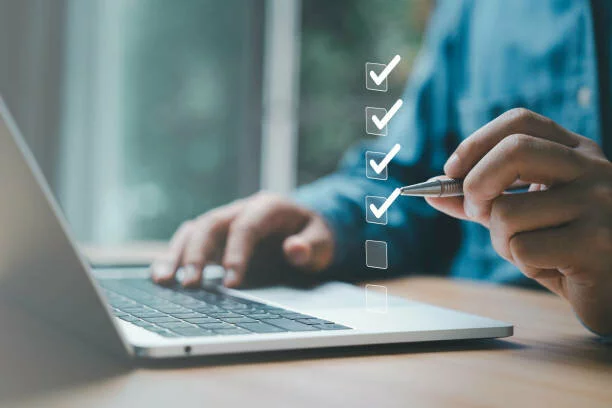 Businessman use pen to tick correct sign mark in checkbox for quality document control checklist and business approve project concept. 2023/12/istockphoto-1499460360-612x612-1.jpg 