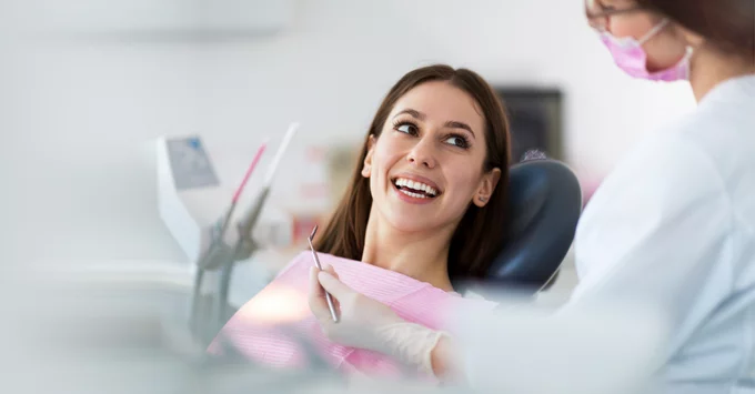Patient in Dental Chair discussing with Oral Care Provider