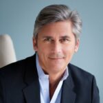 Headshot of Dr. Bill Paveletz in a blue suit jacket