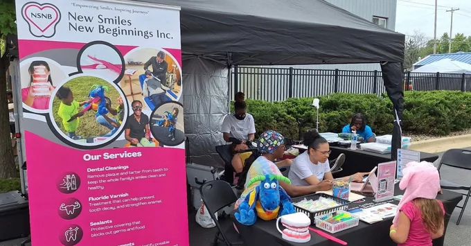 Jazmyn Ragland with a patient and her two female New Smiles, New Beginnings mobile dental clinic team members.