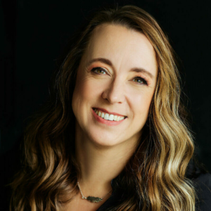 Erin Haley-Hitz, RDH, BSDH, MS, FADHA, MAADH headshot photo in black jacket.