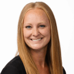 Katie Pudwell, RDH, PhD smiling with black top.