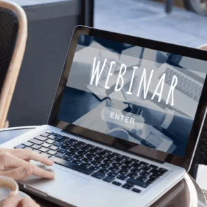 Laptop with screen that reads webinar