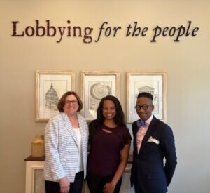 JoAnn Gurenlian, Katherine Williamson and Quardricos Driskell in lobby of Lobbyit firm under their tagline "Lobbying for the people"