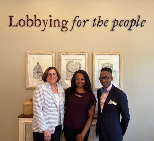 JoAnn Gurenlian, Katherine Williamson and Quardricos Driskell in lobby of Lobbyit firm under their tagline "Lobbying for the people"