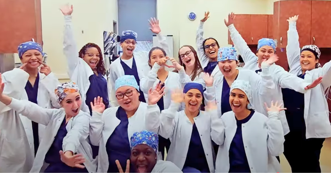 Students in white lab coats from Howard Community College ADHA student chapter.