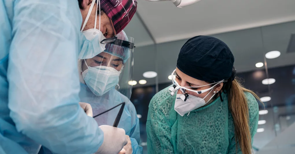 Dental Hygiene Instructors working on a patient