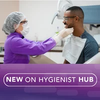Hygienist palpating a patient for oral cancer.