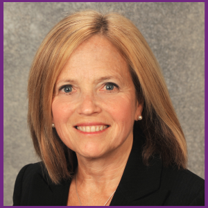 Anita Glicken smiling in black jacket.