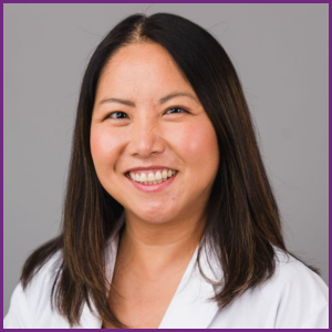 Mychi Nguyen headshot in white lab coat, smiling