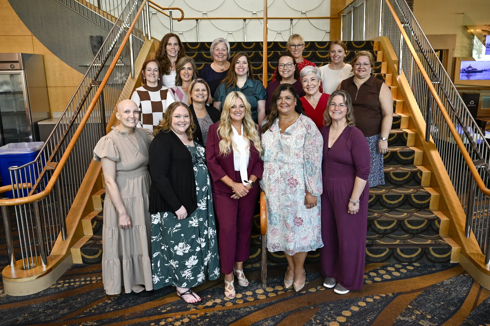 ADHA Board of Directors in a group positioned in rows on a staircase for a group portrait