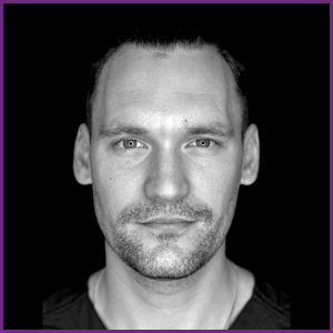 Michael Lazzara, headshot in black shirt