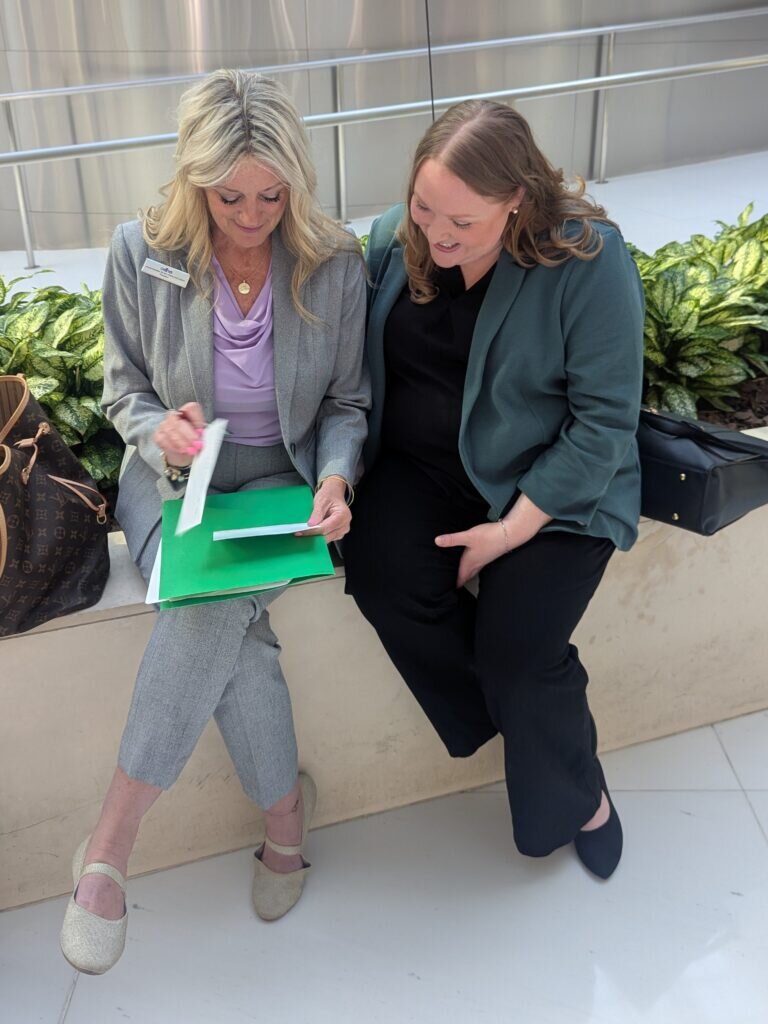 ADHA President and President Elect seated outside and compare notes