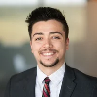 Tyler Huntley headshot; ,smiling