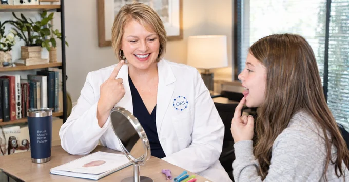 Joy Lantz leading an orofacial myology session with a young patient